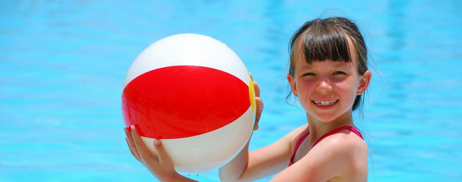 Girl with Beach Ball Playing Family Pool Games