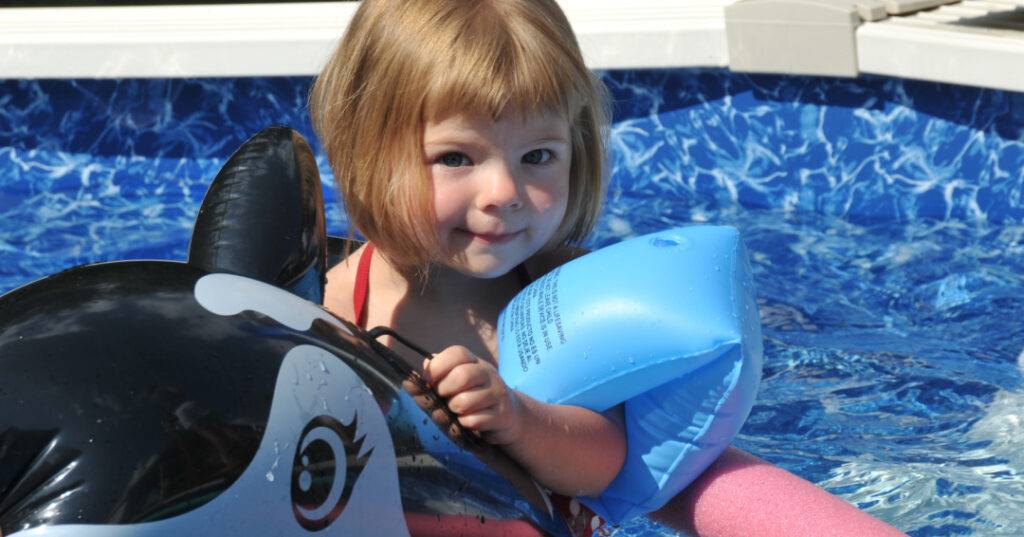 Toddler on a pool float