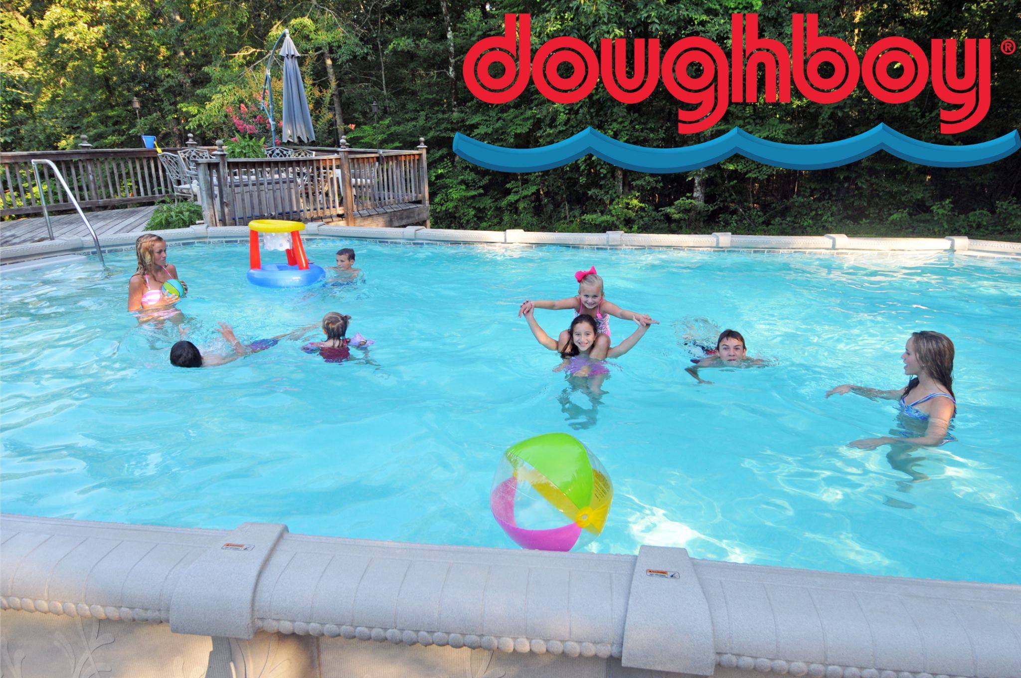 A family playing in a Doughboy above ground pool.