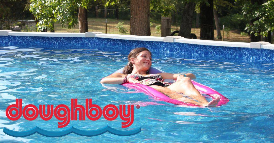 A woman lounging on a float in a Doughboy above ground pools.