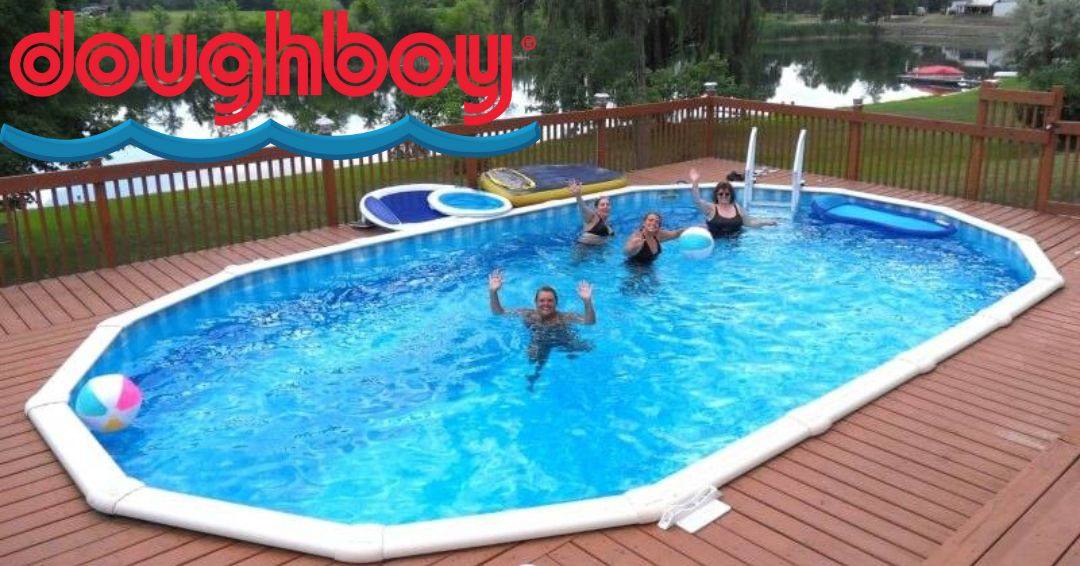 A Doughboy above ground pool recessed in a deck. There is a family in the water playing and waving at the camera.