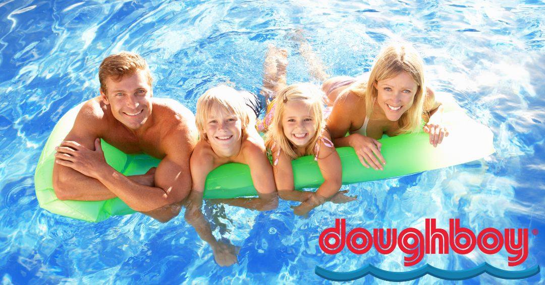 A family leaning on a pool float in a swimming pool.