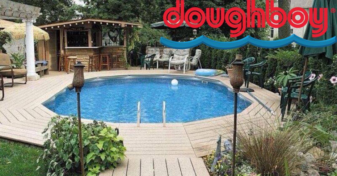 Doughboy pools: a pool with a wooden deck built around it.