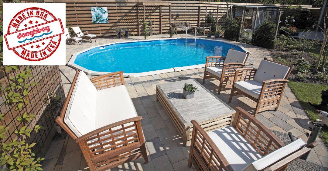 A Doughboy Pool in the background. There is patio furniture and landscaping around the pool.