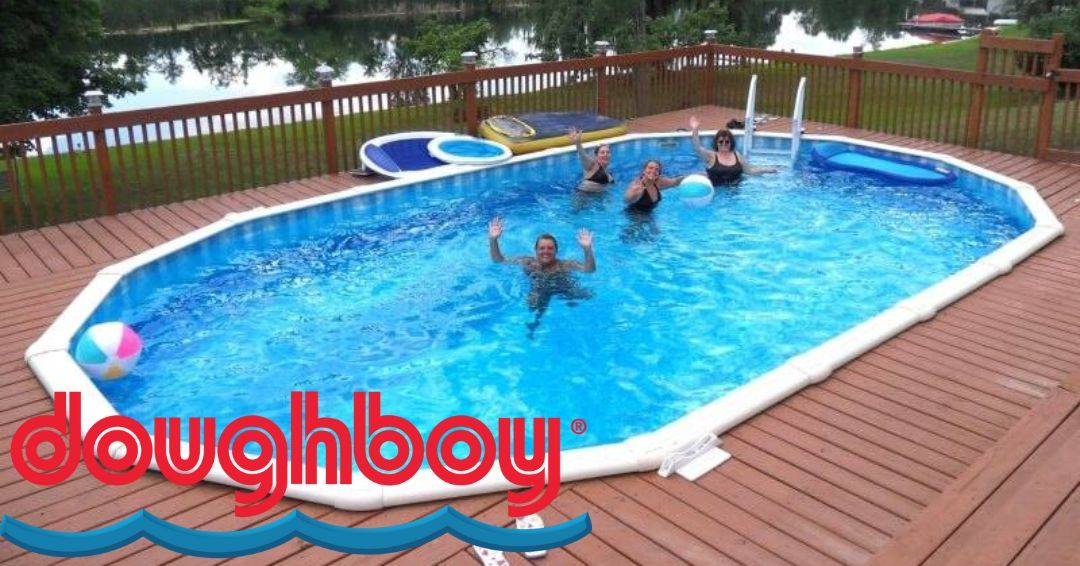 People playing in a Doughboy pool. An above ground pool inset in a wooden deck.